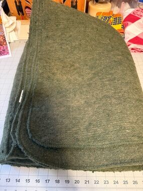 olive green military-style wool blanket.